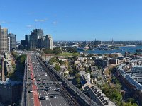 Sydney View 6   Circular Quay and the city to the left of the bridge approach road with  finger wharves and a distant Anzac Bridge to the right.
